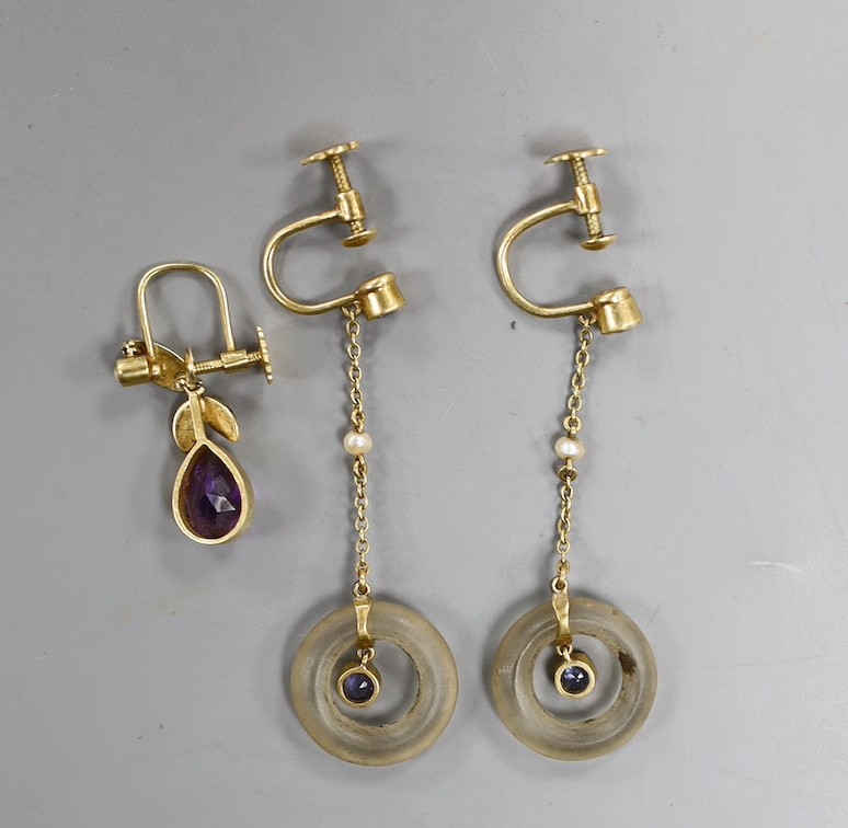 A pair of Edwardian 15ct, frosted glass, seed pear and sapphire set drop ear clips, 41mm and a single 15ct, amethyst and seed pearl set ear clip, gross weight 5.2 grams.